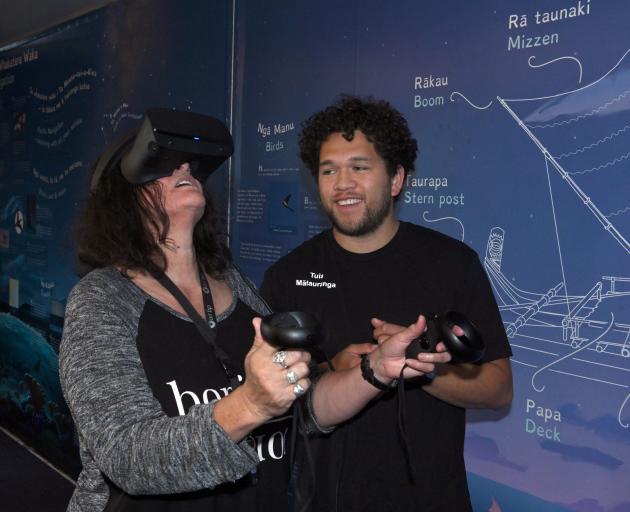 Using virtual reality, Sheryl Boulter, of Dunedin, takes a trip on a waka hourua as part of the...