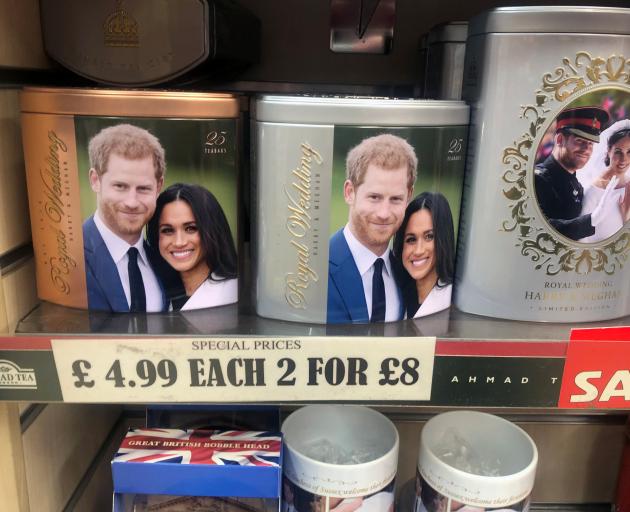 Discounted merchandise depicting Harry and Meghan displayed in a Windsor shop. Photo: Reuters 