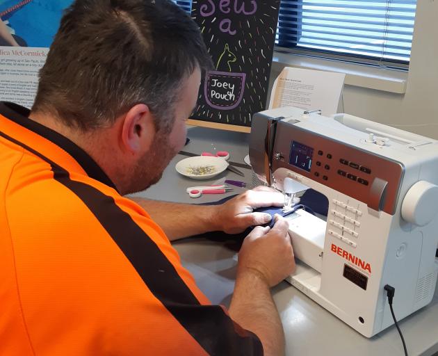 Southbridge resident Ben Wilson dropped in to Leeston Library to sew a joey pouch for the...