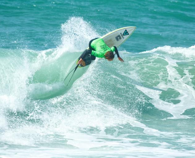 Navryn Malone, of Raglan, in action in the under-16 boys division at the national surfing championships at St Clair Beach yesterday. Photo: Cory/NZ Surfing Magazine