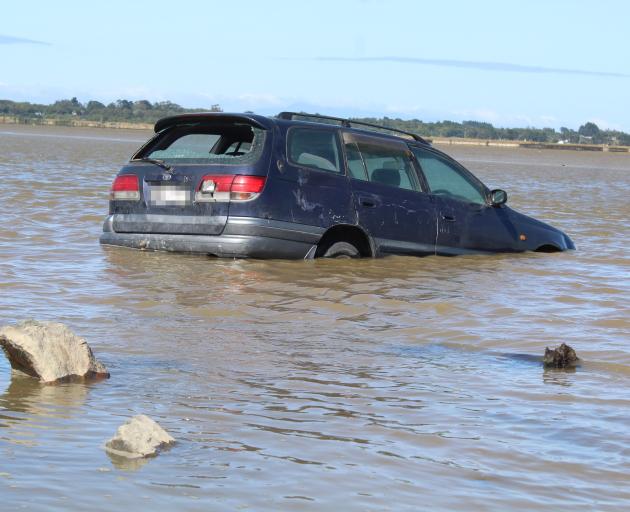 When the car was retrieved, the inside of it was filled with water and sand. Photo: Laura Smith 
