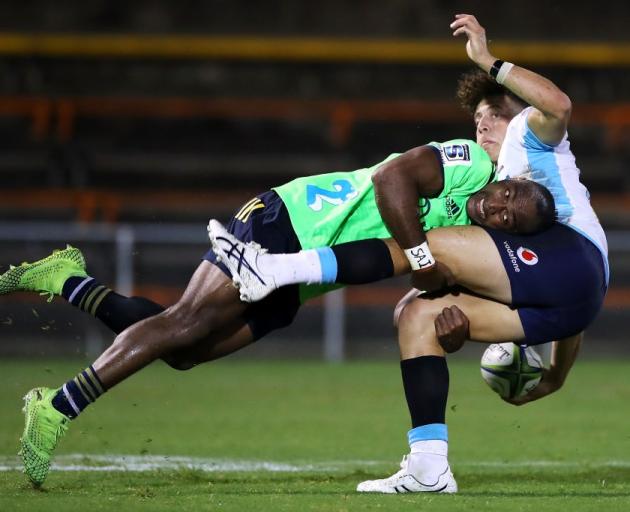 Chris Kuridrani tackles Mark Nawaqanitawase during the Highlanders' trial game against the...
