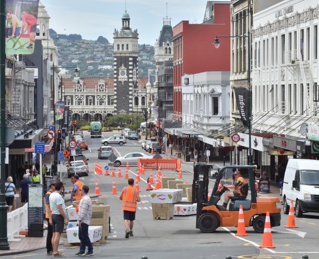 Contractors place planter boxes in lower Stuart St yesterday afternoon. PHOTO: GERARD O’BRIEN
