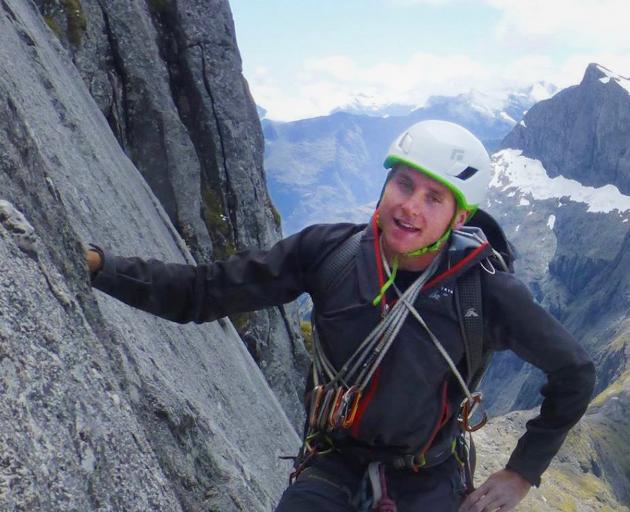 Conor Smith climbing Barrier Knob, in Fiordland in 2016. PHOTO: NEW ZEALAND ALPINE TEAM
