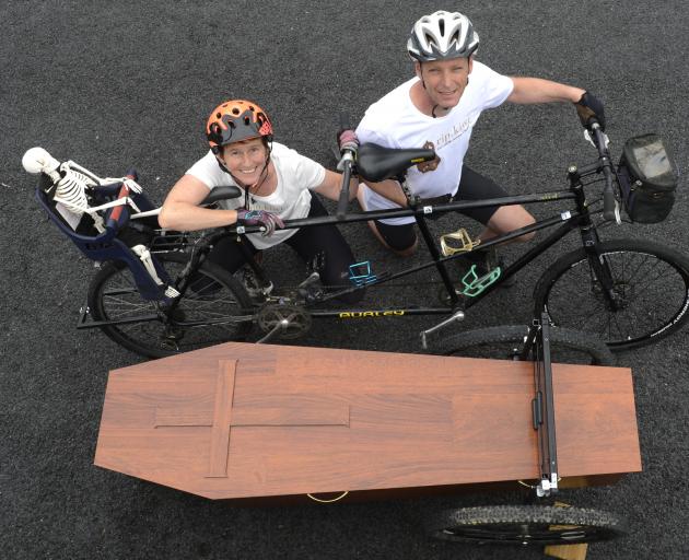 Riding in tandem with a coffin in tow to collect signatures to present to Parliament are Camilla and Julian Cox, of Dunedin. Photo: Gerard O'Brien