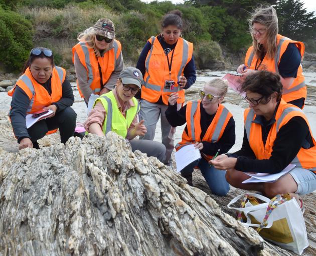University of Otago geology department teaching fellow Dr Sophie Briggs (centre left) explains the features of Haast schist at Brighton beach, near Dunedin, to teachers (from left) Socorro Lakaga (St Kevin’s College), Alison Waller (Opotiki College), Shob