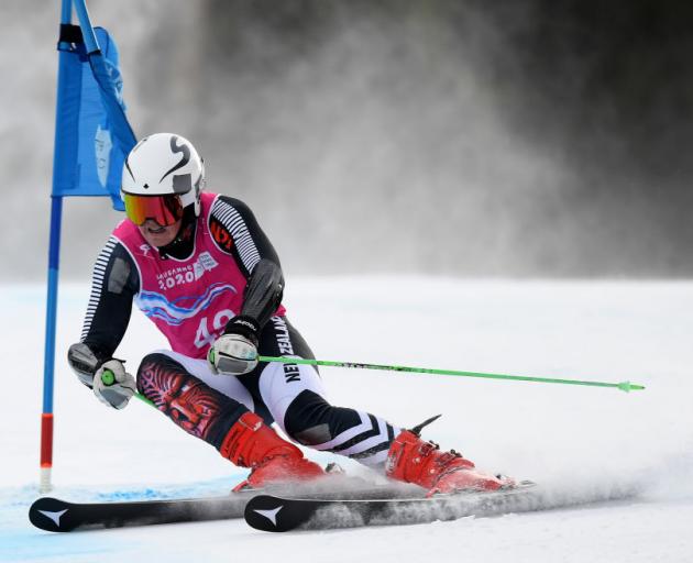 New Zealander Harrison Messenger competes in the first round of the men’s giant slalom at the Winter Youth Olympics in Lausanne yesterday. Photo: Getty Images