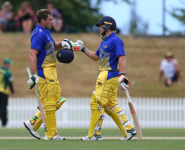Otago Volts batsman Dean Foxcroft is congratulated by team-mate Dale Philips after scoring a century in his team’s Ford Trophy match against the Central Stags at Saxton Field in Nelson yesterday. Photo: Getty Images