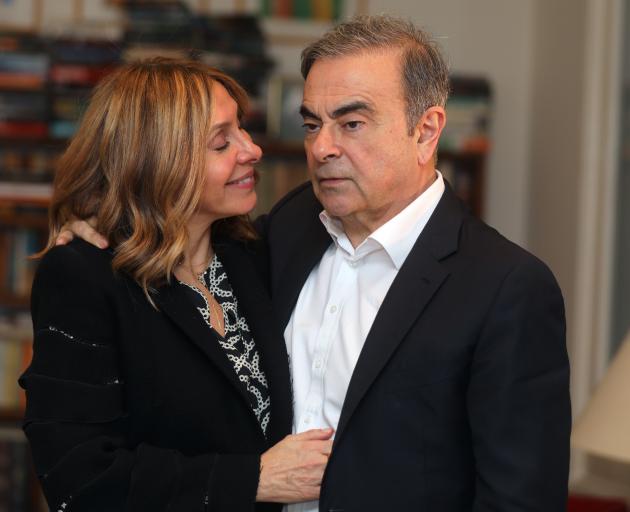 Former Nissan chairman Carlos Ghosn and his wife Carole Ghosn pose for a picture after an...