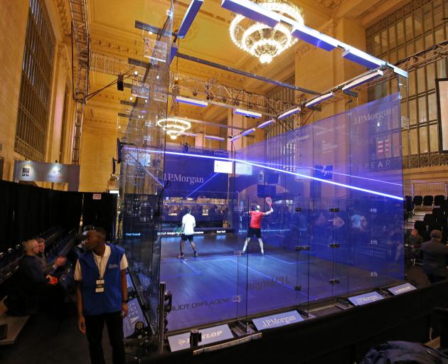 Players in action the first round of the Tournament of Champions squash event at Grand Central Station, New York yesterday. Photo: Tournament of Champions 