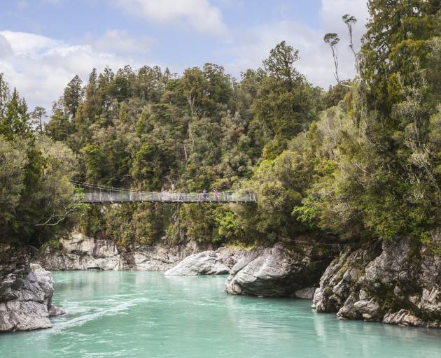 The gorge of the Hokitika River, West Coast, in the South Island of New Zealand. The colour of the water is characteristic of glacier meltwater. Photo: Getty Images