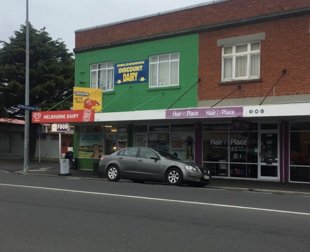 A man has been arrested after an alleged armed robbery at the Melbourne Dairy in South Dunedin....