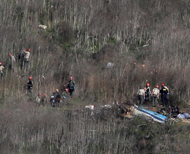 Investigators work at the scene of the helicopter crash which killed NBA star Kobe Bryant in Calabasas. Photo: Reuters
