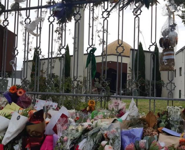 Floral tributes left at the Al Noor Mosque in Christchurch after the attack on 15 March last year...