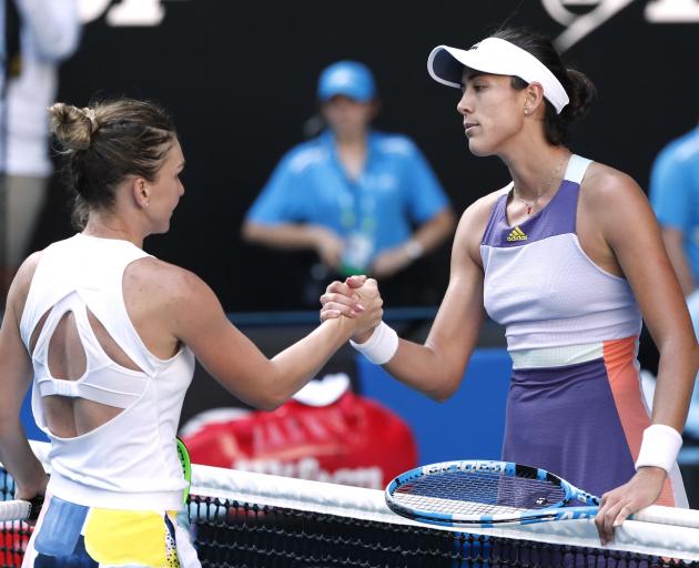 Spain’s Garbine Muguruza and Romania’s Simona Halep shake hands after their match. Photo: Reuters Spain’s Garbine Muguruza and Romania’s Simona Halep shake hands after their match. Photo: Reuters
