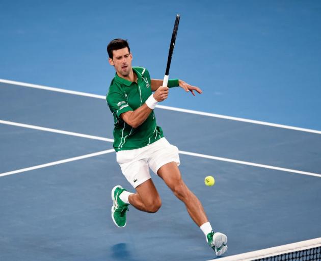Novak Djokovic plays a shot during his quarterfinal win at the Australian Open. Photo: Getty Images