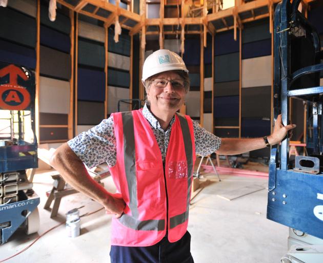 Standing in the new recording studio at the University of Otago is the head of the School of...