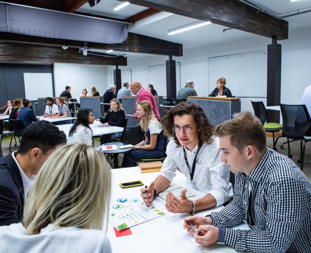 Students make the most of the expert advice on offer. Photo: UC