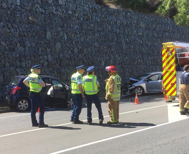 Emergency services at the crash scene this afternoon. Photo: Guy Williams