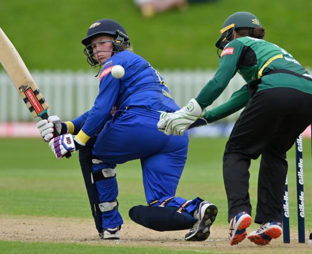 Sparks top scorer Millie Cowan flicks the ball past Hinds wicketkeeper Natalie Dodd during their...