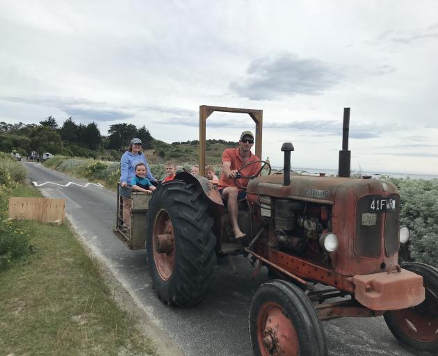 East Otago farmer Will Heckler shuttles precious cargo back to the holiday house after a day at the beach. On the back are his wife, Laura, with Ria Heckler (5), Taj Morey (8), Lucia Morey (9) and Luke Heckler (6). Photo: Alice Scott