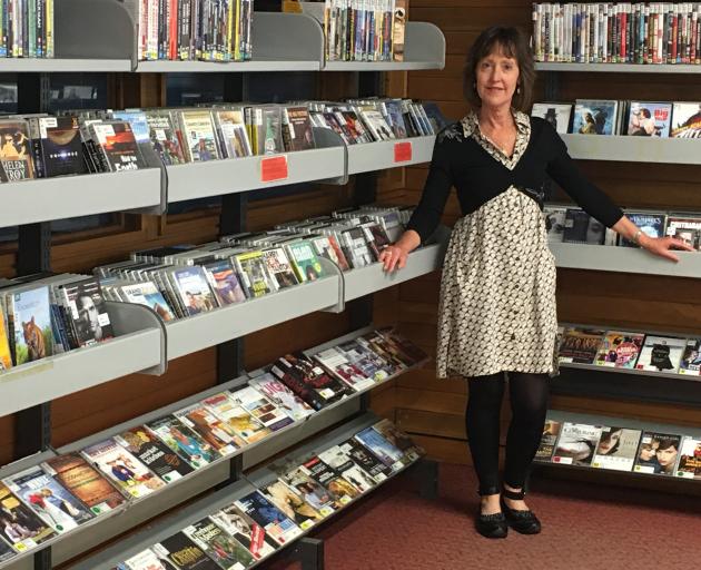 Dunedin Public Libraries DVD, Blu-ray, and CD collection manager Glenda Rogers has thousands of items available for hire. PHOTO: SUPPLIED