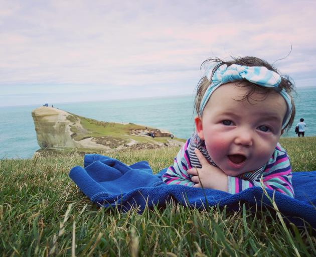 FIRST PRIZE: Ruth Mountfort (5 months) gives her visiting whanau a tour of Tunnel Beach. PHOTO:...