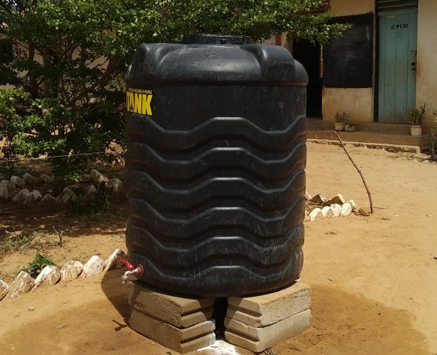 A tank for pupils to collect water to flush the toilets of a new toilet block in Tanzania. 