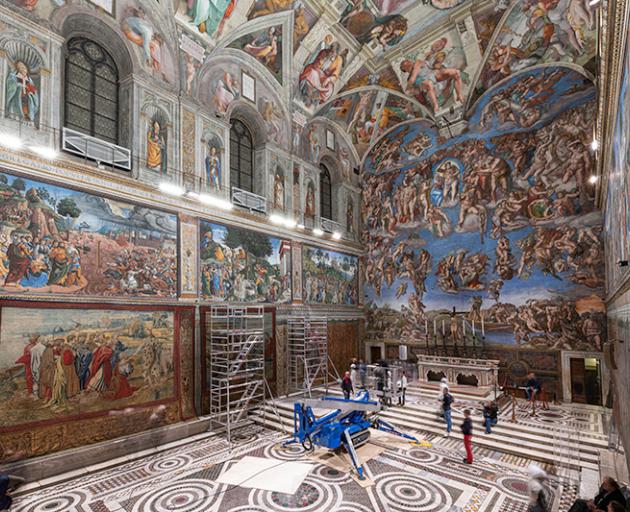 A tapestry is installed on a lower wall of the Sistine Chapel. Photo Governatorato SCV ©...