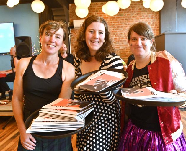 Roller derby competitors (from left) Annette King, Shanna Verhoef and Ella Strong distribute pamphlets at the launch of the 2020 Fringe Festival in Dunedin last night. Photo: Linda Robertson