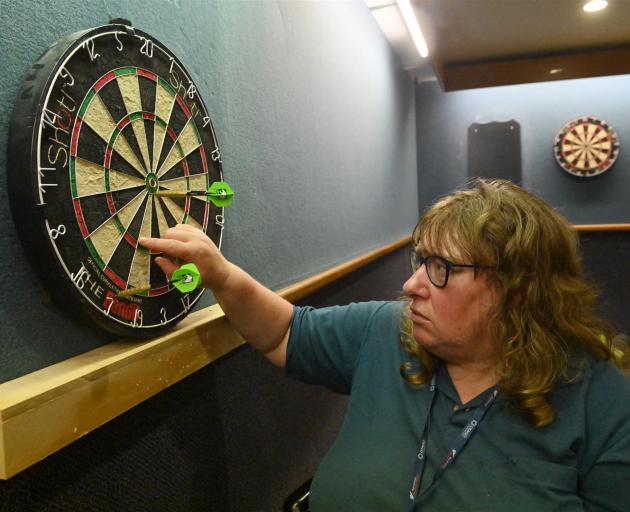 Suzanne McGregor, of Dunedin, checks her shot.