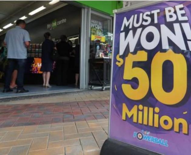 People queued up outside Lotto outlets around the country to get tickets for the record $50...