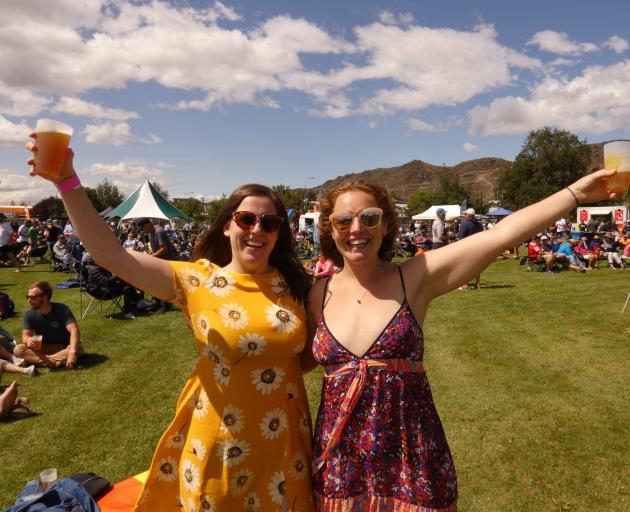 Sarah Bowden (left) and Caitlin Bowie, both of Dunedin, enjoy the sunshine during the Central...