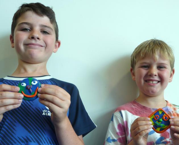 Enjoying the mirror art session were (from left) brothers Toby and Cohen Greer from Halswell, who...