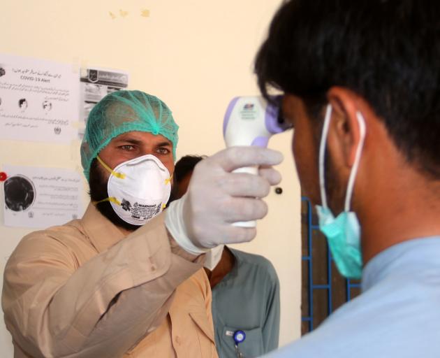 People are being checked globally for signs of the virus. Photo: Reuters