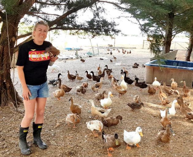 Kim Hartley with some of her ducks Photo: RNZ/Cosmo Kentish-Barnes