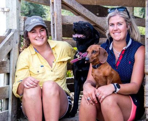 Elle Perriam (left) with Jess the Huntaway and Harriet Bremner with Poppy. Photo: Dana Johnston