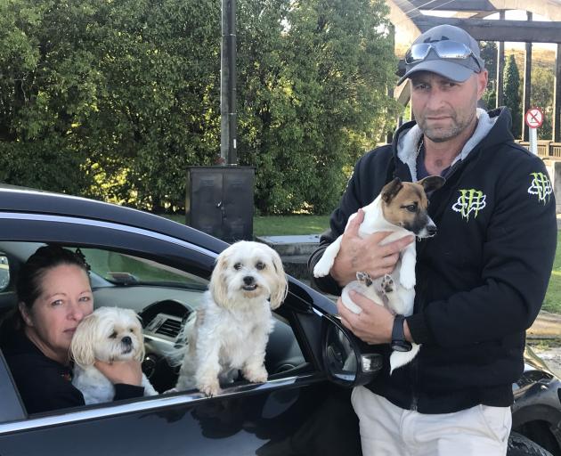 Veronica and Corey Woodrow and their dogs Pocket, Pixie and Mocha were evacuated from their Mataura home early yesterday. Photo: Luisa Girao