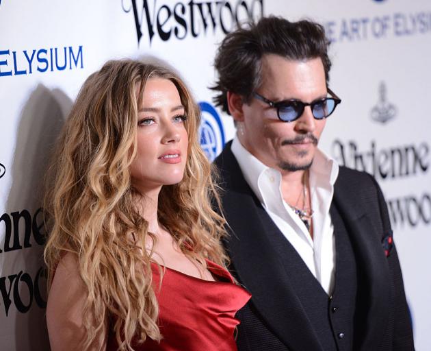 Amber Heard with Johnny Depp in 2016. Photo: Getty Images 