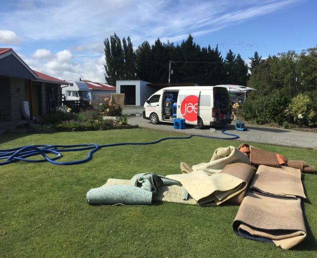 The cleanup has begun for residents and contractors of those living close by the Mataura River in East Gore. Photo: Gregor Richardson
