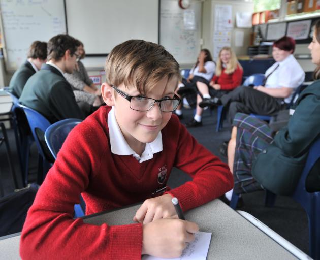 Seth Tulloch (14) prepares some notes to introduce himself to his new Whanau Group at Kaikorai Valley College yesterday. Photo: Christine O'Connor