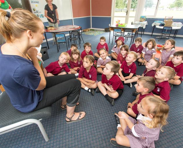 Mairehau Primary School teacher Jenny Postles reads to pupils. Photo: Martin Hunter