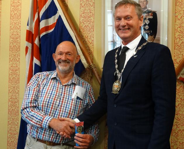 Peter Ellis (left) is congratulated by Waitaki Mayor Gary Kircher after being sworn in as the...