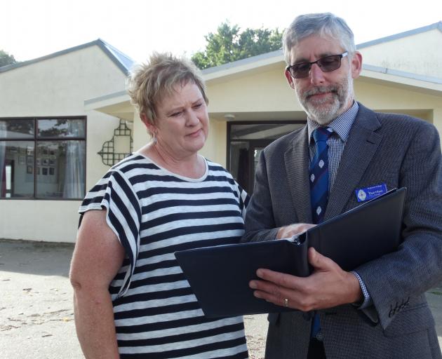 St Kevin’s College hostel matron Lou Pearson and principal Paul Olsen look through possible plans...