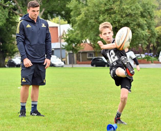 Highlanders first five-eighth Bryn Gatland watches as Riley Mair (10) kicks for goal. The...