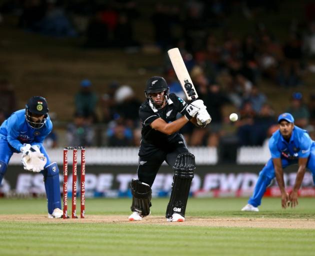 Ross Taylor plays the ball through the offside on his way to a century against India at Seddon...