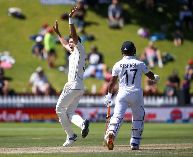 Tim Southee of New Zealand appeals successfully for the wicket of Ravichandran Ashwin of India...
