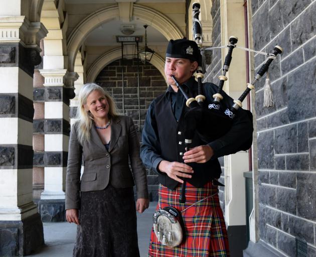 Anna Walls watches her son Wren Monks play the bagpipes in Dunedin on Monday. PHOTO: SHAWN MCAVINUE
