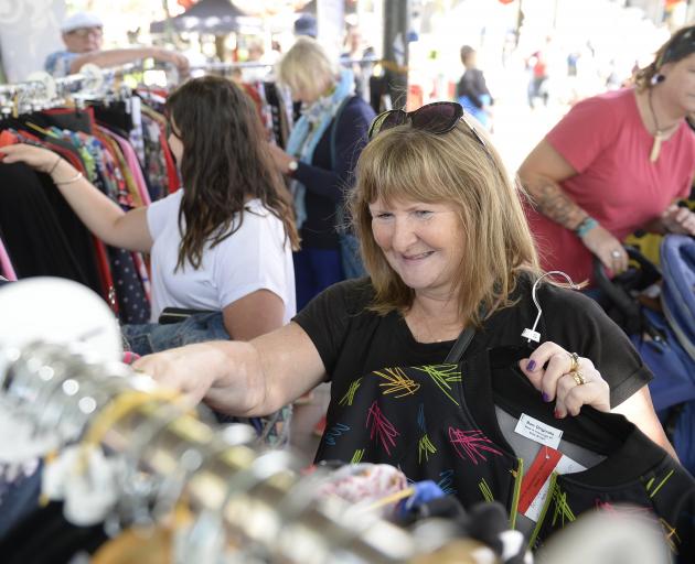Lisa Davis looks through clothing at the Thieves Alley market. PHOTO: GREGOR RICHARDSON