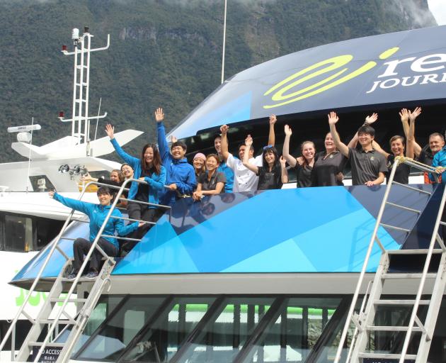 On board...Real Journeys Milford Sound cruise crew got together to celebrate the road being one...